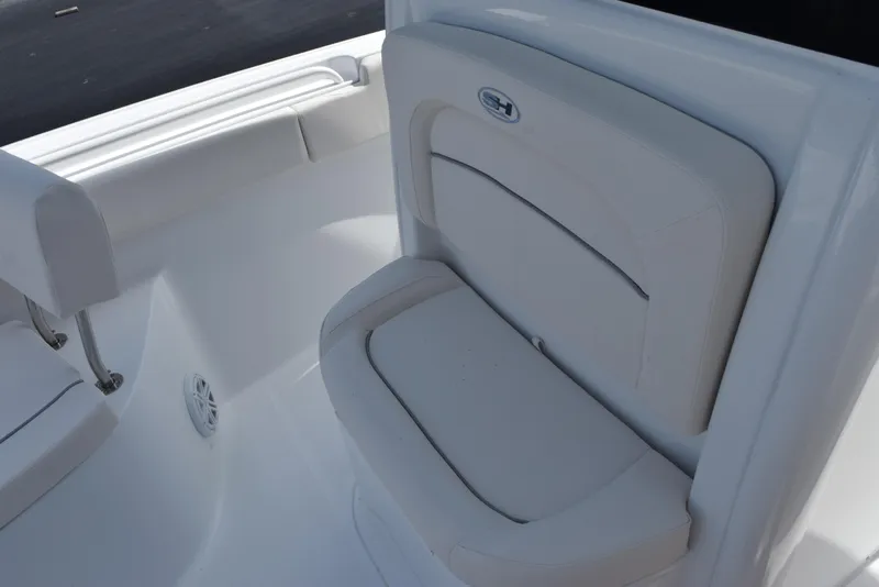 Slide: The Image of 2026 Sea Hunt Ultra 245 SE boat seat with white upholstery. - 13
