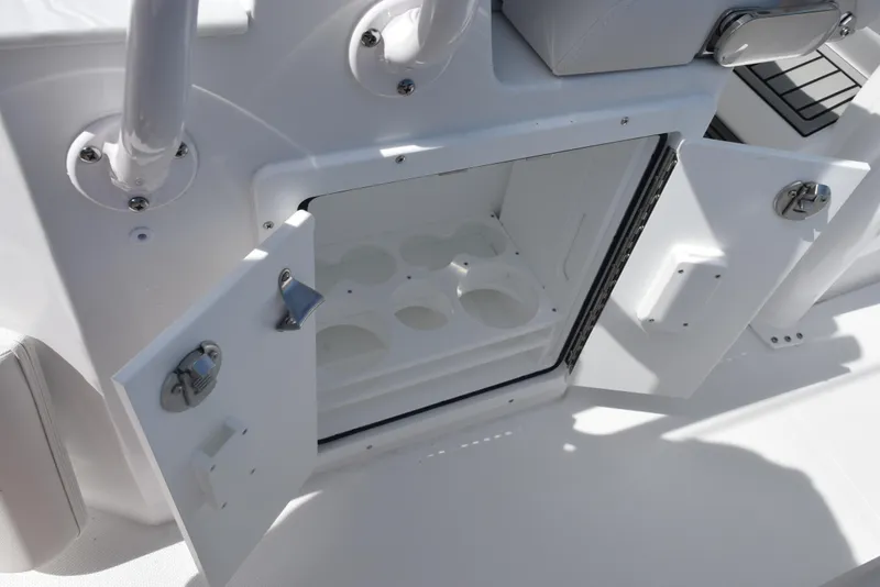 Slide: The Image of Open storage compartment on 2026 Sea Hunt Ultra 245 SE boat. - 21