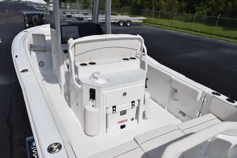Slide: The Image of 2026 Sea Hunt Ultra 245 SE boat interior with seating and console. - 7