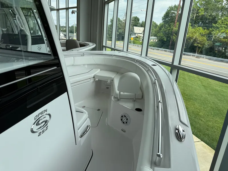 Slide: The Image of 2025 Sportsman Open 252 Center Console boat interior in showroom setting. - 6