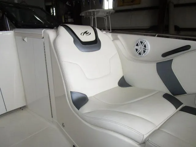 Slide: The Image of 2007 Monterey 298SSX Super Sport boat interior with white and gray seating. - 11