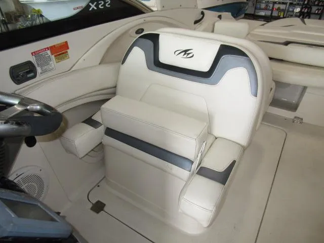 Slide: The Image of 2007 Monterey 298SSX Super Sport boat interior with white and gray seating. - 13