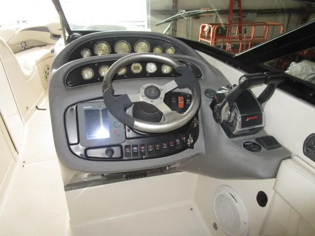 Slide: The Image of 2007 Monterey 298SSX Super Sport boat interior with white seating and sleek design. - 15