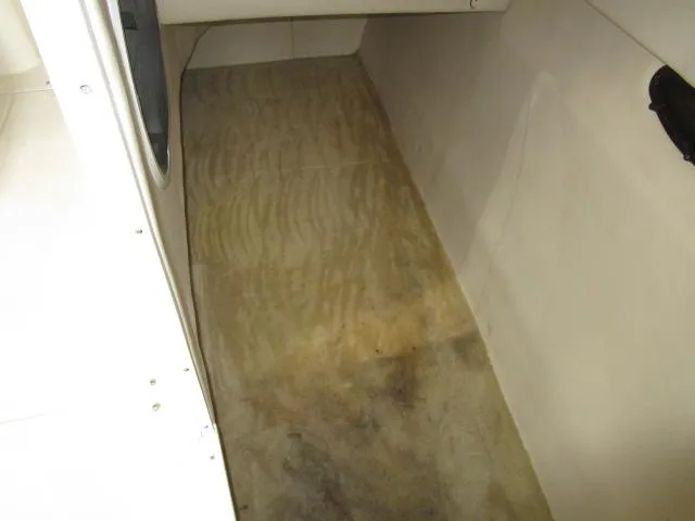 Slide: The Image of 2007 Monterey 298SSX Super Sport boat propeller and stern drive on checkered floor. - 20