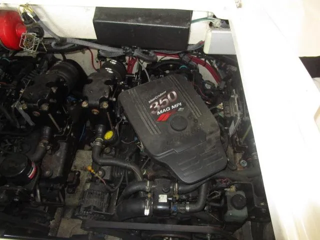 Slide: The Image of 2007 Monterey 298SSX Super Sport boat with black cover in showroom. - 21