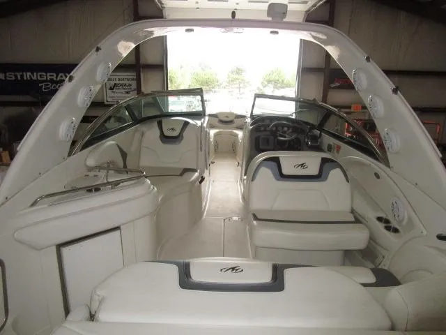 Slide: The Image of 2007 Monterey 298SSX Super Sport boat interior with white seating and speaker system. - 5