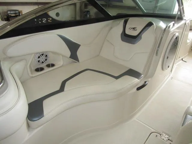 Slide: The Image of Compact bathroom in 2007 Monterey 298SSX Super Sport boat, featuring a toilet and sink. - 9