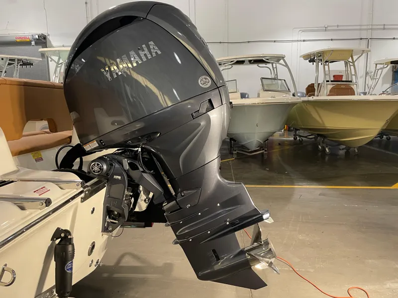 Slide: The Image of 2025 Key West 203 FS boat with Yamaha outboard motor in showroom. - 10