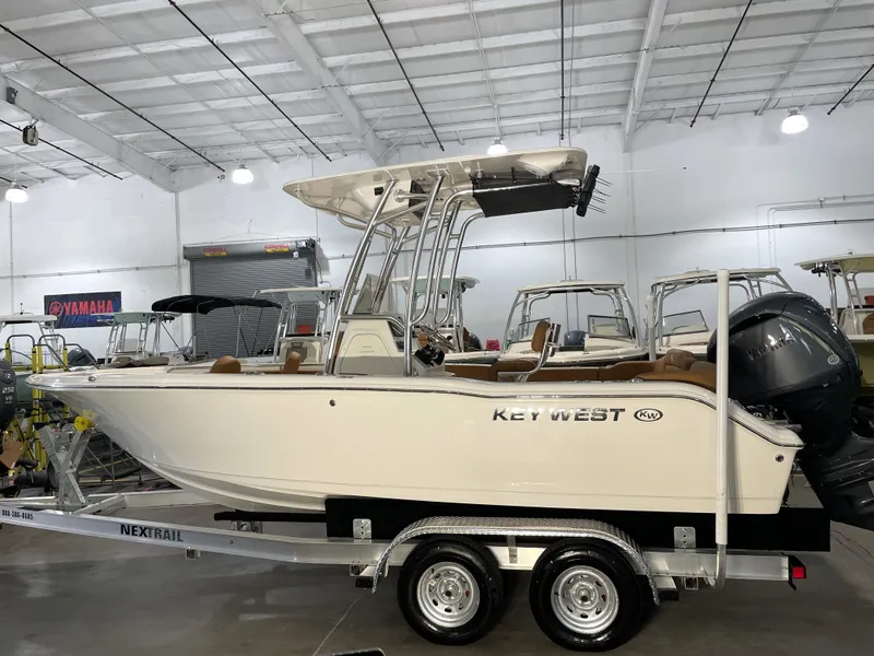 Slide: The Image of 2025 Key West 203 FS boat on trailer in showroom. - 4