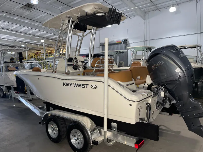 Slide: The Image of 2025 Key West 203 FS boat on trailer in showroom. - 5