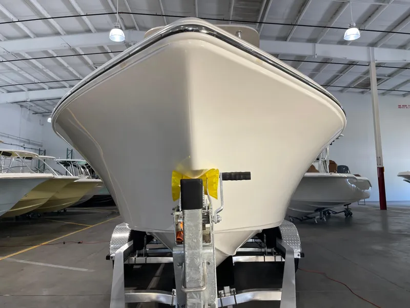 Slide: The Image of 2025 Key West 203 FS boat in showroom, front view on trailer. - 7