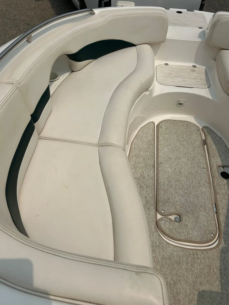 Slide: The Image of Chaparral Sunesta 233 2000 boat interior seating, white and blue upholstery. - 12