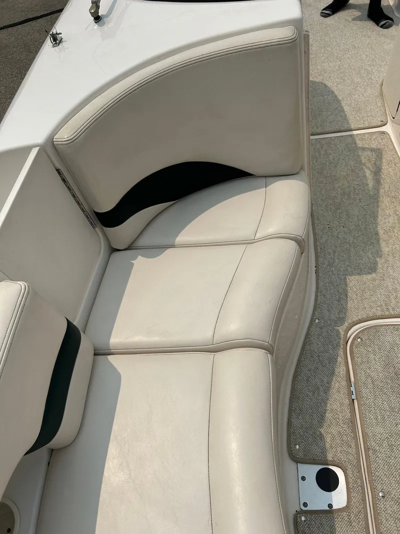 Slide: The Image of Trailer wheel of 2000 Chaparral Sunesta 233 boat on gravel surface. - 13