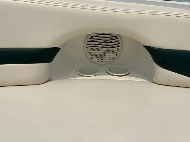 Slide: The Image of 2000 Chaparral Sunesta 233 boat deck with white hatch and sleek design. - 15