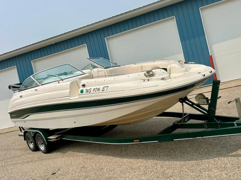 Slide: The Image of Trailer wheels of a 2000 Chaparral Sunesta 233 boat on a textured surface. - 3