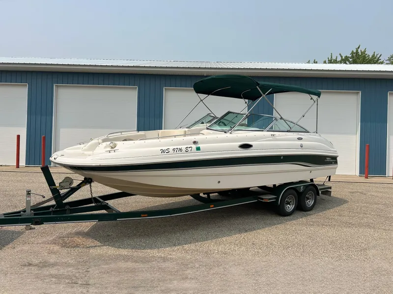 Slide: The Image of Chaparral Sunesta 233 2000 boat seat with white and blue upholstery. - 32