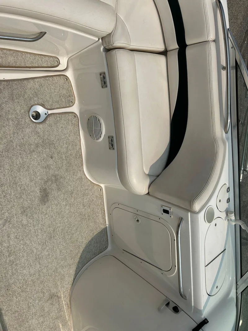 Slide: The Image of 2000 Chaparral Sunesta 233 boat deck with hatch and stainless steel fittings. - 38