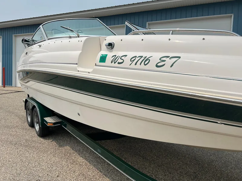 Slide: The Image of 2000 Chaparral Sunesta 233 boat, blue and white exterior, close-up view. - 4
