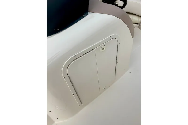 Slide: The Image of 2000 Chaparral Sunesta 233 boat interior storage compartment. - 45