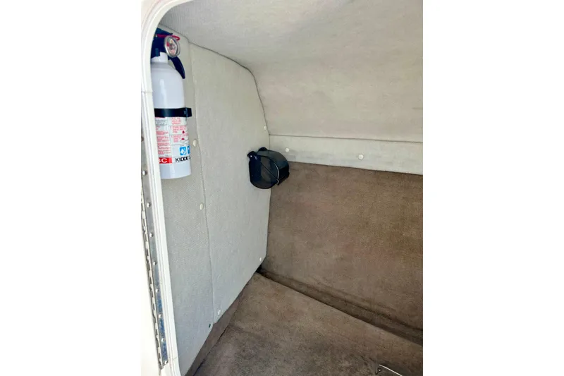 Slide: The Image of Interior of 2000 Chaparral Sunesta 233 boat with fire extinguisher. - 48