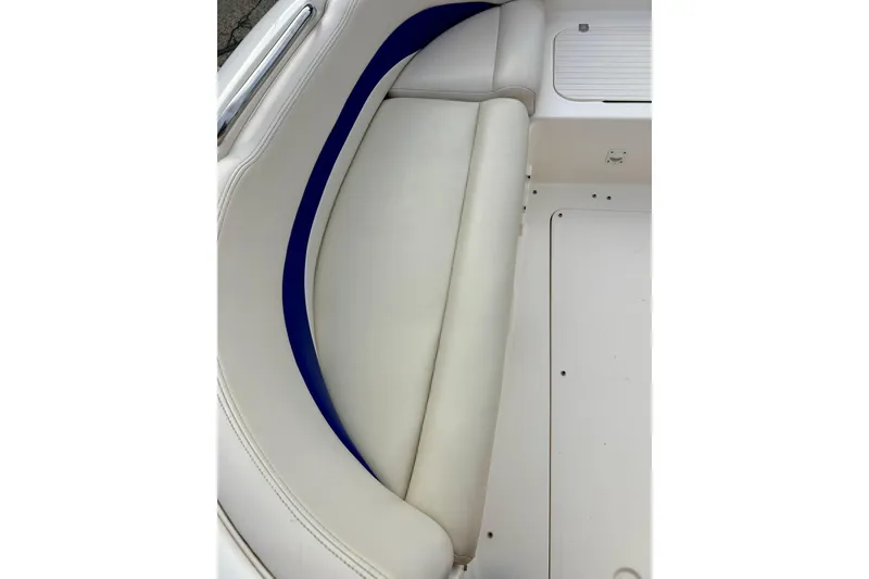 Slide: The Image of 2000 Chaparral Sunesta 233 boat interior with white and blue seating. - 50