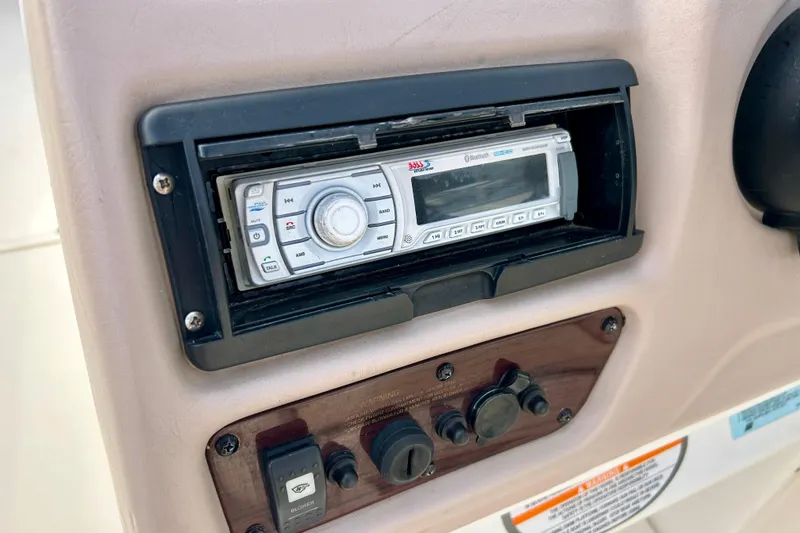 Slide: The Image of Control panel of a 2000 Chaparral Sunesta 233 boat with stereo system. - 58