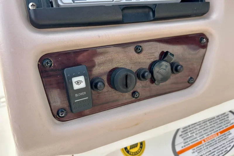Slide: The Image of Control panel of a 2000 Chaparral Sunesta 233 boat with blower switch. - 59