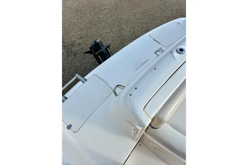 Slide: The Image of 2000 Chaparral Sunesta 233 boat deck with seating and swim platform. - 65