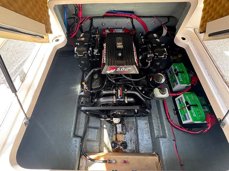 Slide: The Image of Engine compartment of a 2001 Sea Ray 245 Weekender with a 5.0L MerCruiser engine. - 10