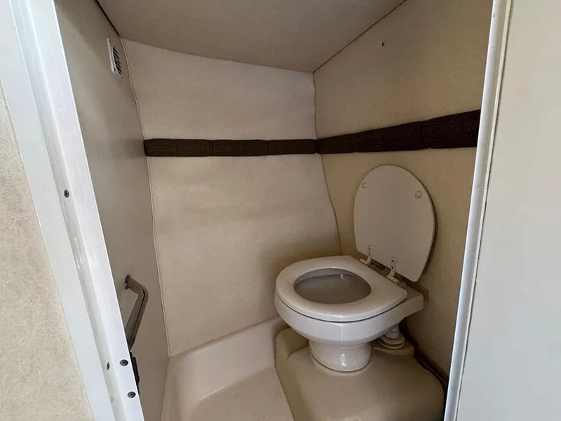 Slide: The Image of 2001 Sea Ray 245 Weekender boat bathroom interior with toilet. - 20