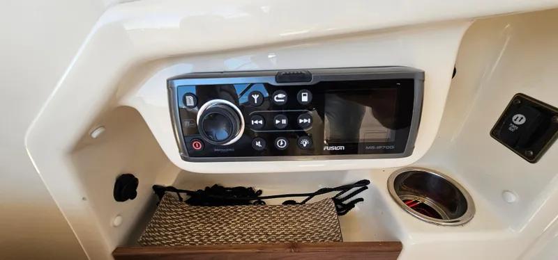 Slide: The Image of 2014 Grady-White Freedom 285 boat cockpit with steering wheel and control panel. - 17