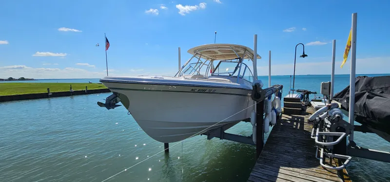 Slide: The Image of 2014 Grady-White Freedom 285 boat with twin Yamaha 250 engines on sparkling water. - 27