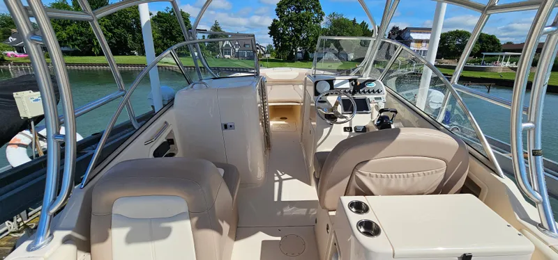 Slide: The Image of 2014 Grady-White Freedom 285 boat docked by a scenic waterfront. - 6