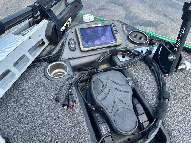 Slide: The Image of 2020 Triton 20 TRX Patriot boat dashboard with Minn Kota pedal and Lowrance display. - 12