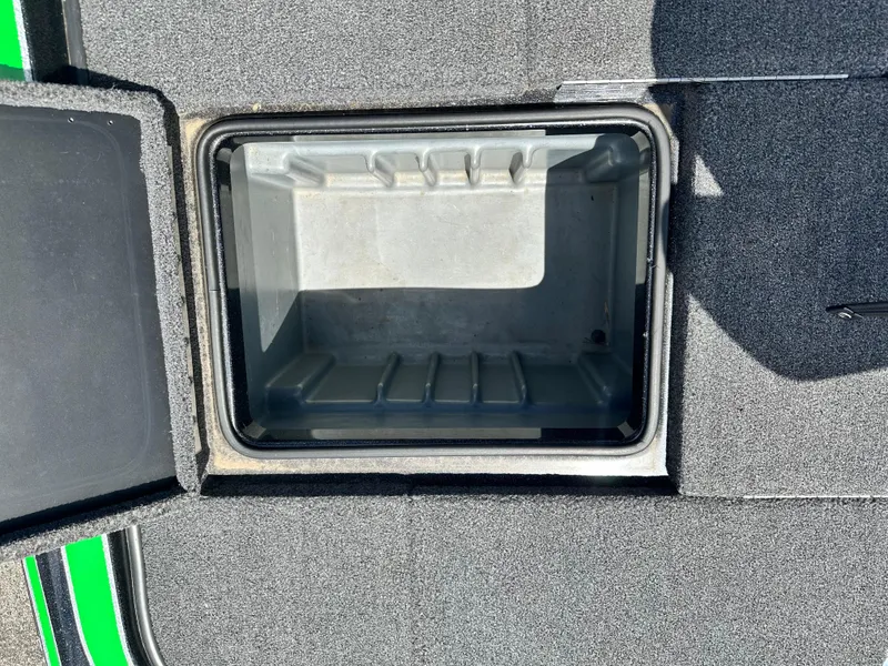Slide: The Image of Open storage compartment on 2020 Triton 20 TRX Patriot boat deck. - 17