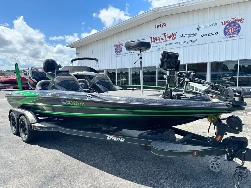 Slide: The Image of 2020 Triton 20 TRX Patriot boat on trailer outside dealership. - 3