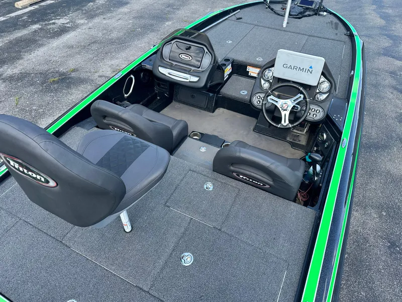 Slide: The Image of 2020 Triton 20 TRX Patriot boat interior with Garmin navigation system and seating. - 8