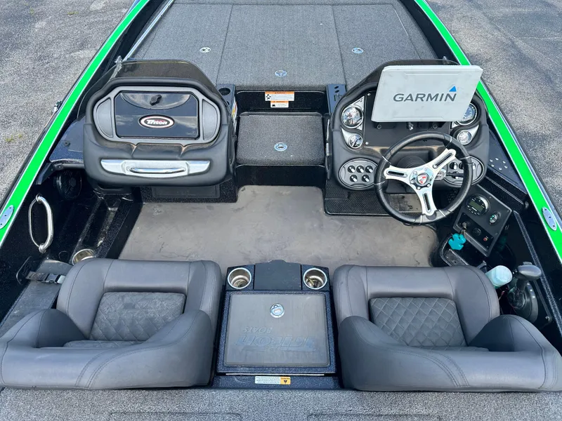 Slide: The Image of 2020 Triton 20 TRX Patriot boat interior with Garmin navigation system and dual seating. - 9