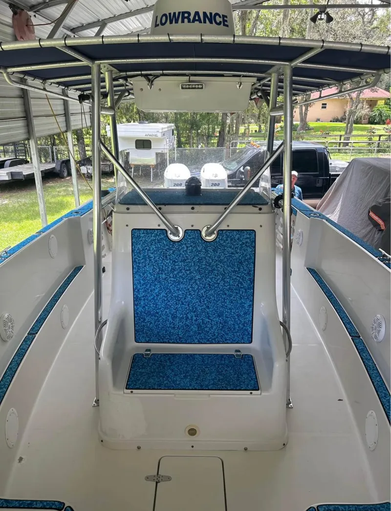 Slide: The Image of 1996 Pro-Line 27 CC boat interior with blue accents and Lowrance equipment. - 7
