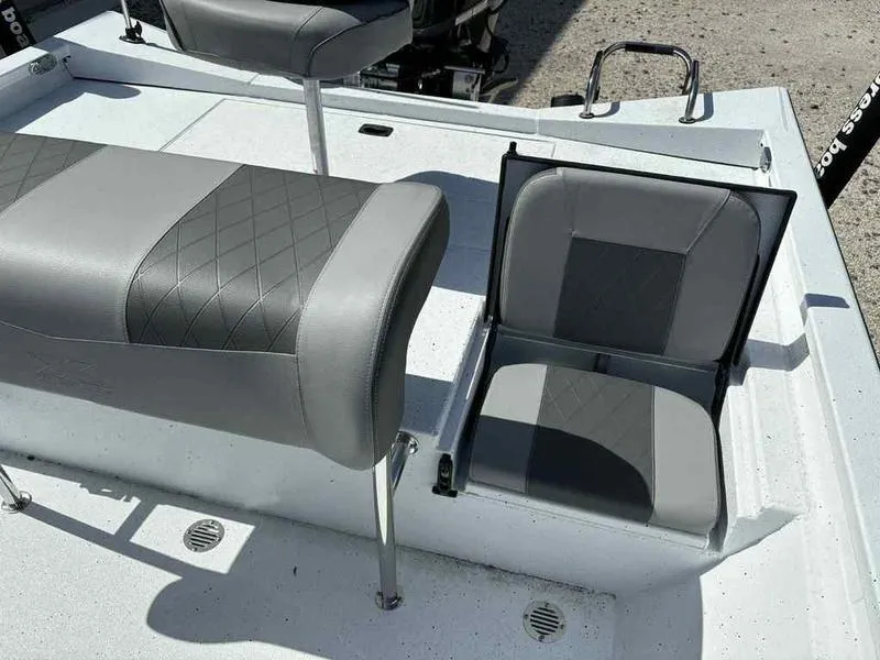 Slide: The Image of 2026 Xpress H22B boat seats with gray upholstery and diamond stitching. - 12