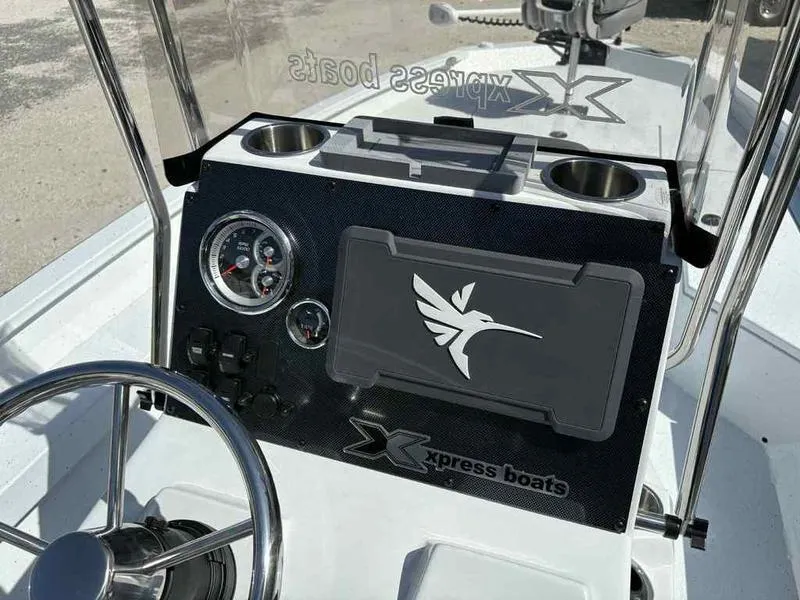 Slide: The Image of Console of 2026 Xpress H22B boat with steering wheel and gauges. - 16