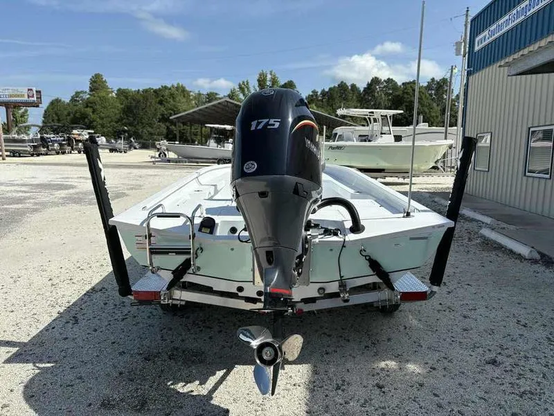 Slide: The Image of 2026 Xpress H22B boat with 175 horsepower engine, parked outdoors. - 2