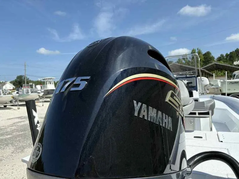 Slide: The Image of Yamaha 175 outboard motor on Xpress H22B boat, 2026 model, under clear blue sky. - 6