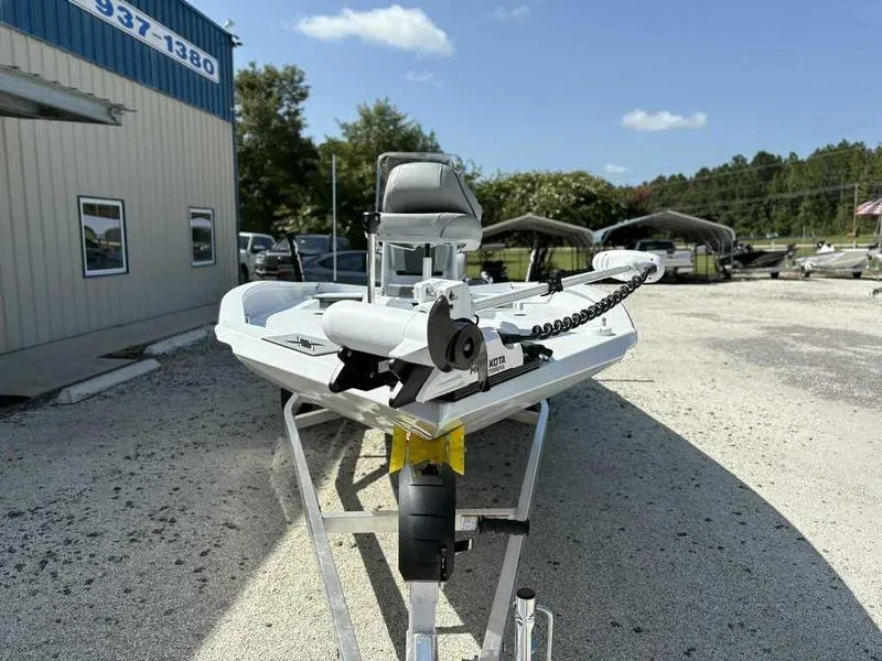 Slide: The Image of 2026 Xpress H22B boat on trailer, parked outdoors under clear sky. - 7