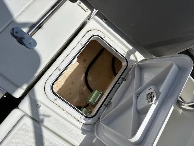 Slide: The Image of Open hatch on 2019 Beneteau Antares 27 boat deck, showing interior compartment. - 14