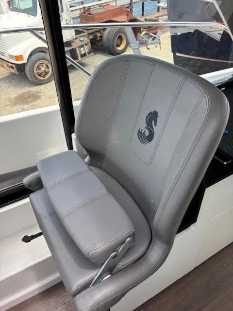 Slide: The Image of Gray captain's chair in 2019 Beneteau Antares 27 boat interior. - 15