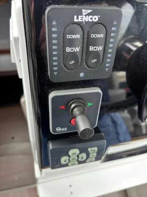 Slide: The Image of Control panel of a 2019 Beneteau Antares 27 boat with Lenco trim tab switches. - 23