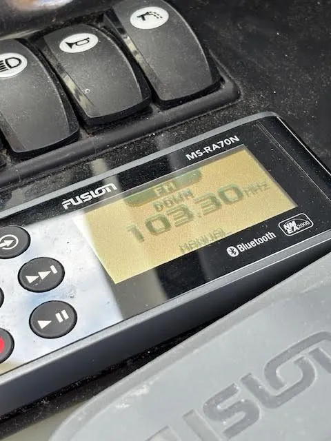 Slide: The Image of Fusion MS-RA70N radio on Beneteau Antares 27, displaying FM 103.3 MHz frequency. - 24