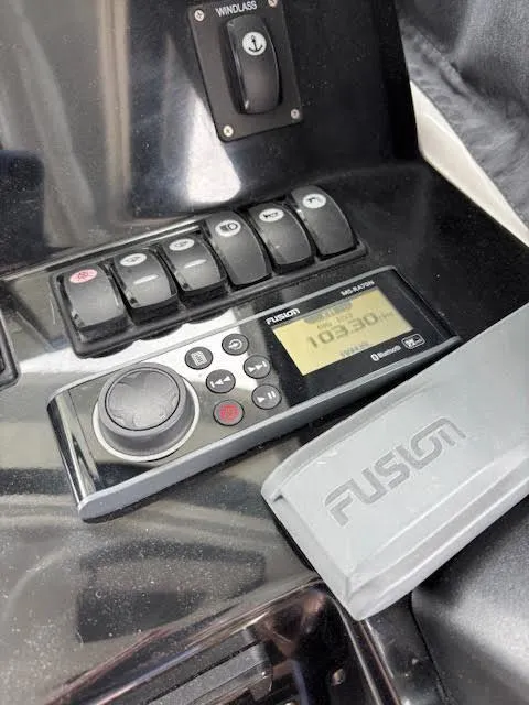 Slide: The Image of Control panel of a 2019 Beneteau Antares 27 with Fusion marine stereo system. - 26