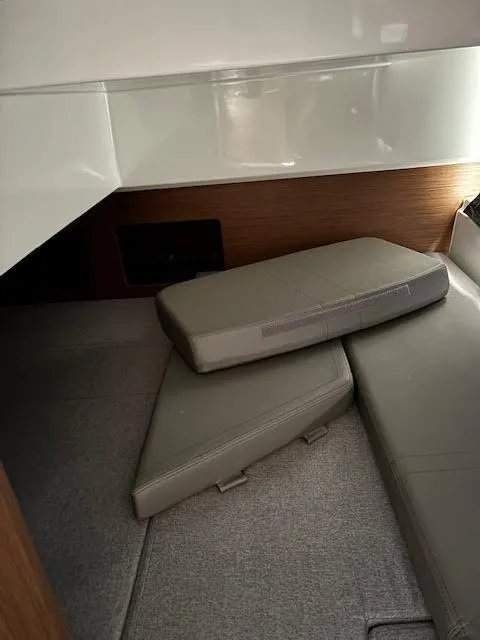 Slide: The Image of Interior cabin of 2019 Beneteau Antares 27 with cushioned seating. - 27